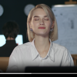 Business woman meditating in yoga pose